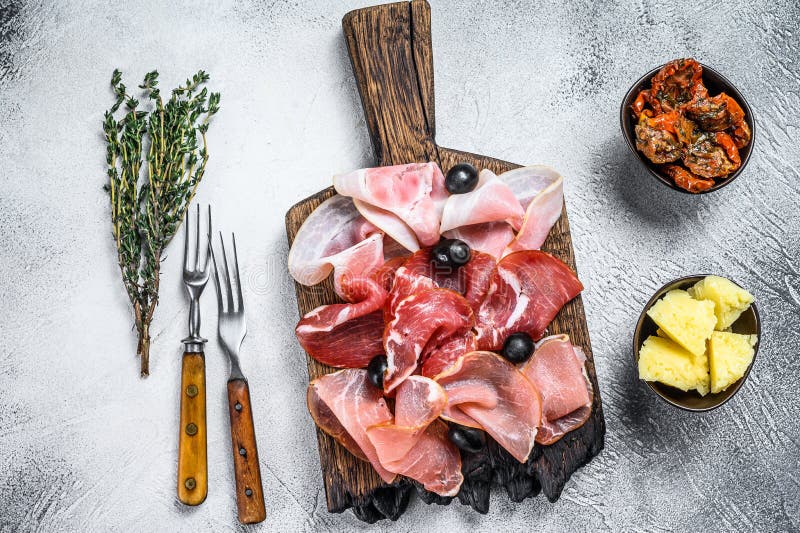 Cured Meat Platter of Traditional Spanish Tapas. White Background Stock