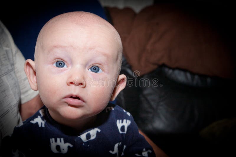Curious Baby With Big Blue Eyes royalty free stock images