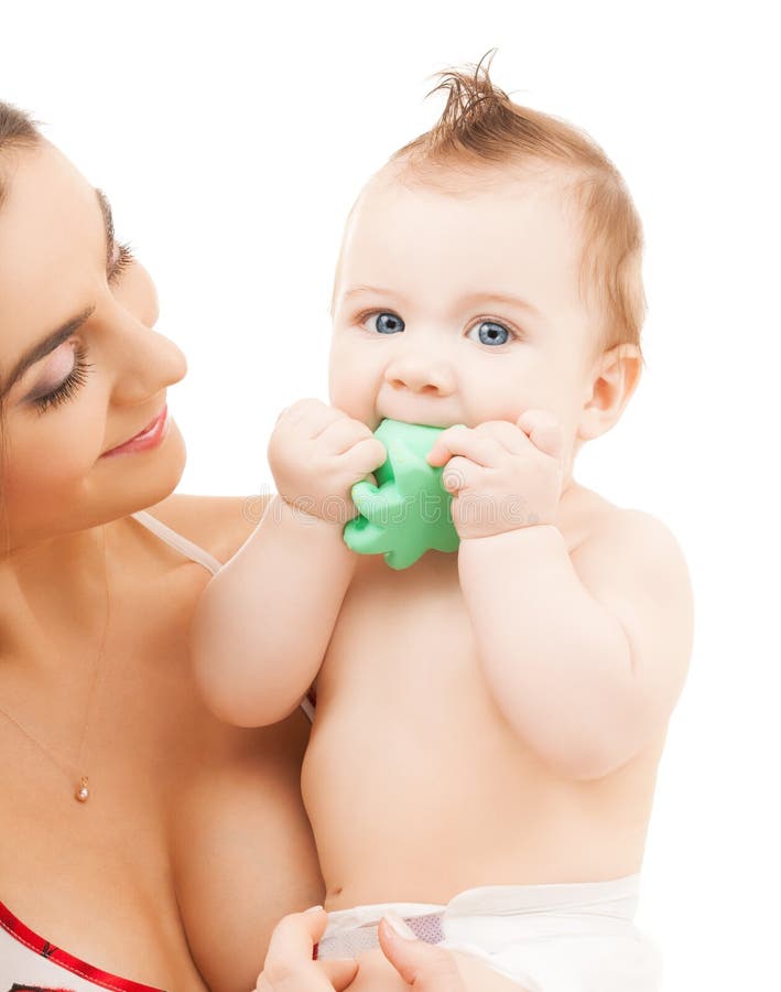 Curious baby biting toy royalty free stock photo