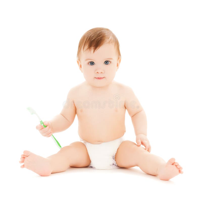 Curious baby brushing teeth royalty free stock photo