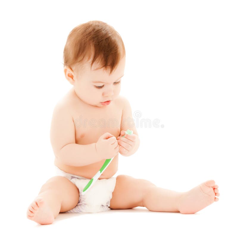Curious baby brushing teeth stock images