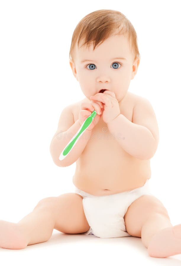 Curious baby brushing teeth royalty free stock image