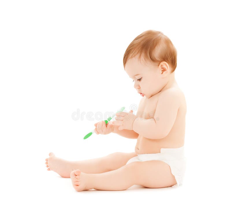 Curious baby brushing teeth royalty free stock image