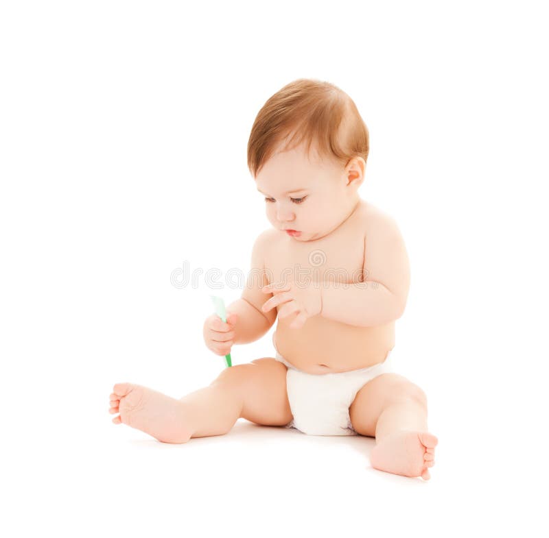Curious baby brushing teeth royalty free stock image