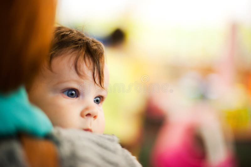 Curious baby looking focused stock image