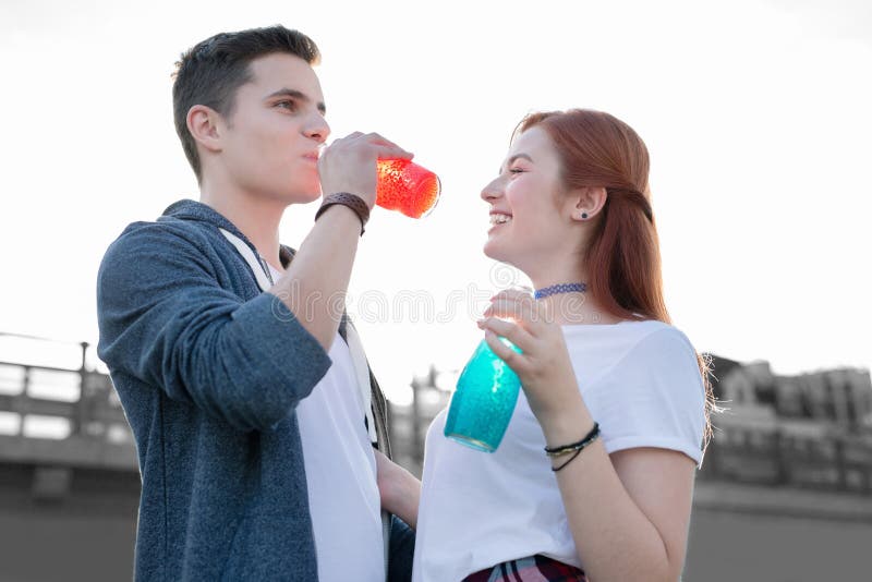 Curious Couple Feeling Interested While Enjoying Unusual Cocktails