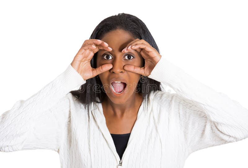 Curious surprised shocked woman peeking, through fingers like binoculars