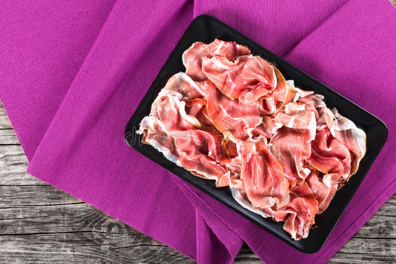 Curled Slices of Delicious Prosciutto on Black Rectangular Dish Stock Image Image of cured