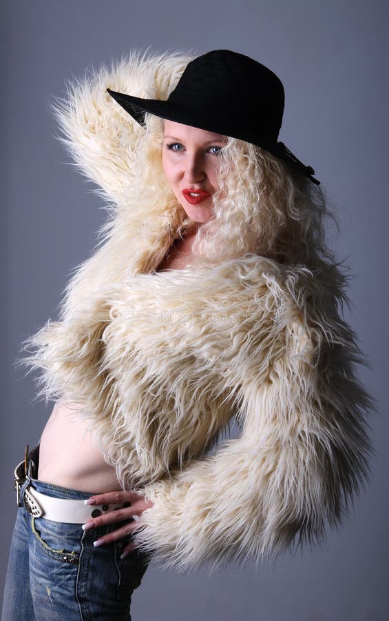 Curly blonde in a red hat stock image. Image of long 20083065