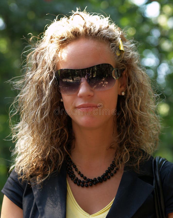 Curly girl with sunglasses