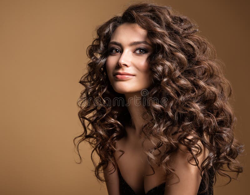 Curly Hair Model. Woman Wavy Long Hairstyle. Brunette Fashion Girl with  Volume Hairdo and Natural Make Up Over Beige Background Stock Image - Image  of background, attractive: 242865635
