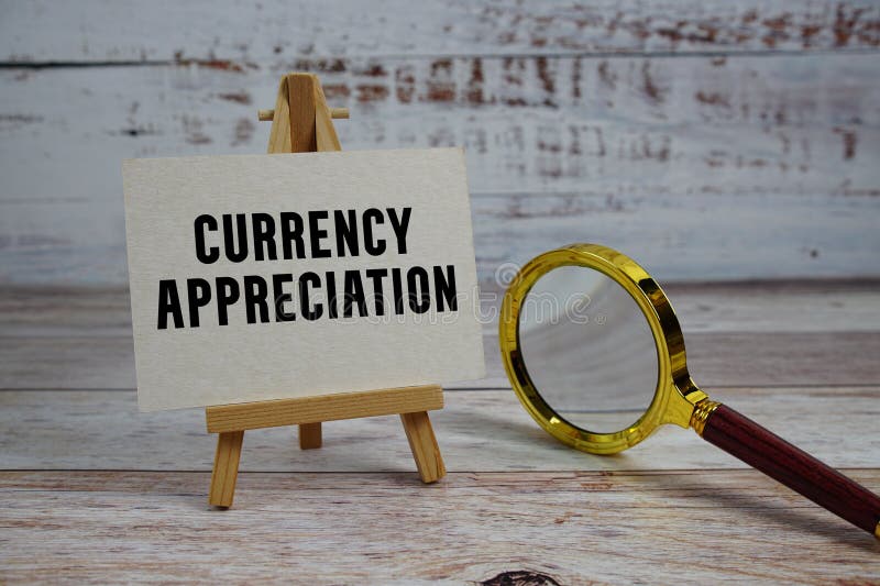 Currency Appreciation text written on paper with magnifying glass royalty free stock photography