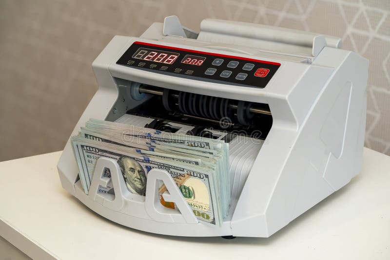 Currency counting machine in use for efficient cash handling stock images