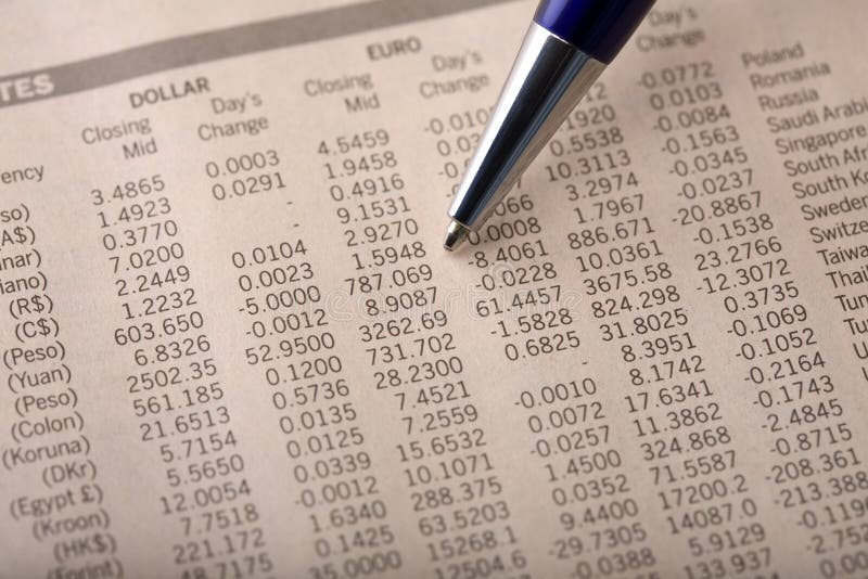 Currency Exchange Rates in Financial Newspaper stock photos