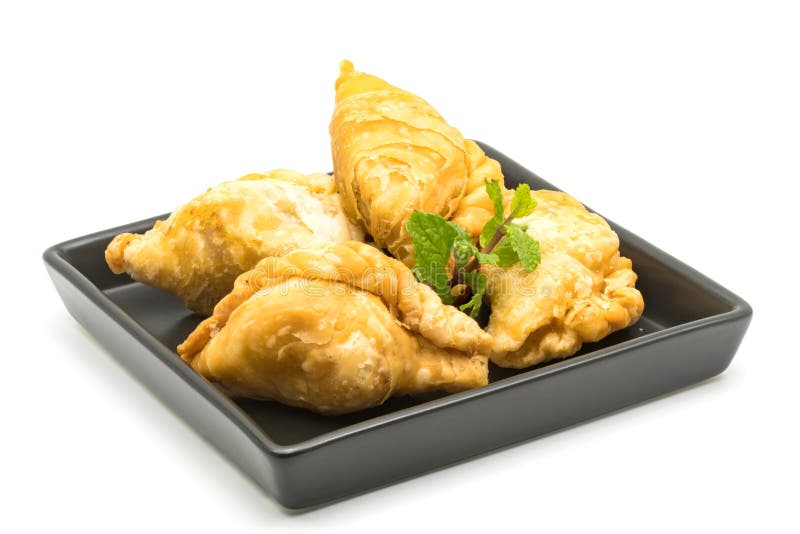 Curry Puffs in a black plate stock photography