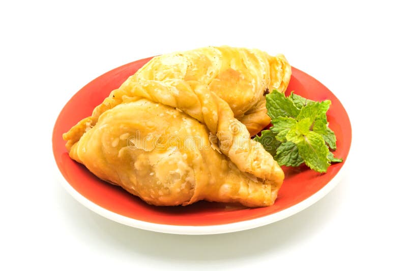 Curry Puffs in a red plate stock image