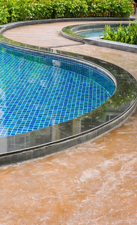 Curve of swimming pool stock photo. Image of hotel, poolside 25075766