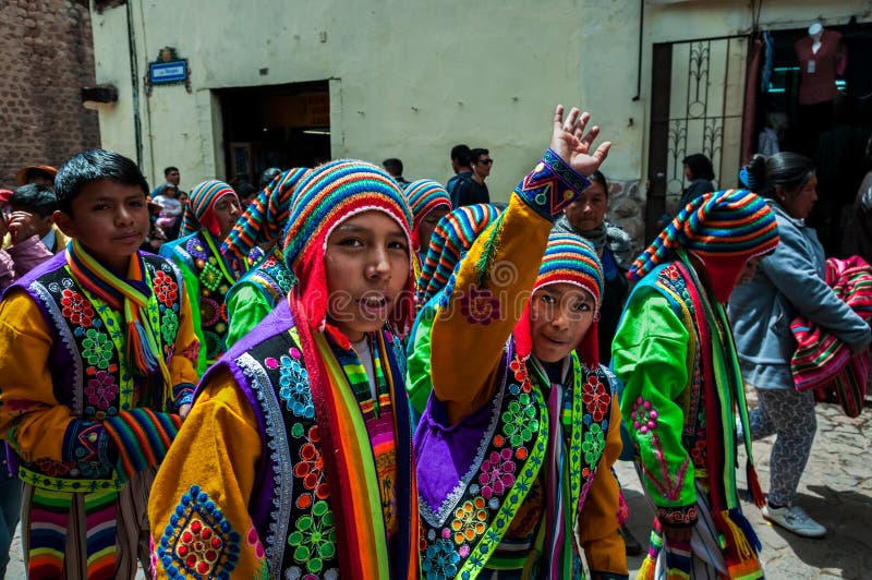 CUSCO, PERU - OCTOBER 7, 2016: Peruvian boys wearing traditional clothes take part in a festive procession. stock photo CUSCO, PERU - OCTOBER 7, 2016: Peruvian boys wearing traditional clothes take part in a festive procession. stock photo