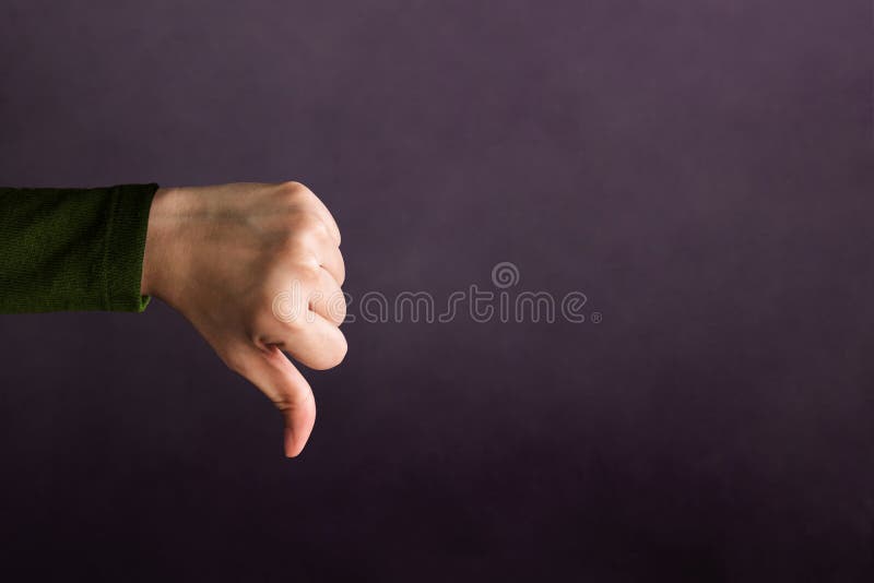 Customer Experience Concept, Hand of Client show Bad sign with Thumb down for Rating in Satisfaction Survey, Symbol of Meaning `Poor`