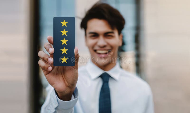 Customer Experiences Concept. Happy Young Businessman Giving Five Stars Rating and Positive Review on Card. Client`s Satisfaction Surveys. Front View
