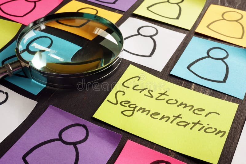 Customer Segmentation marketing concept. Magnifying glass and papers