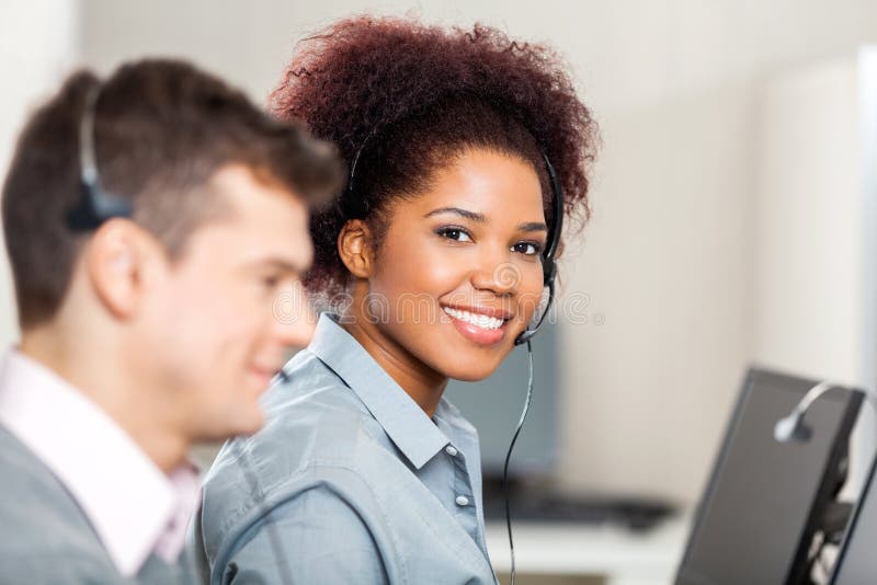 Customer Service Representative Working In Office Stock Image