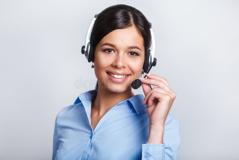 Customer support phone operator in headset, with blank copyspace area for slogan or text message, over grey background stock photography Customer support phone operator in headset, with blank copyspace area for slogan or text message, over grey background stock photography