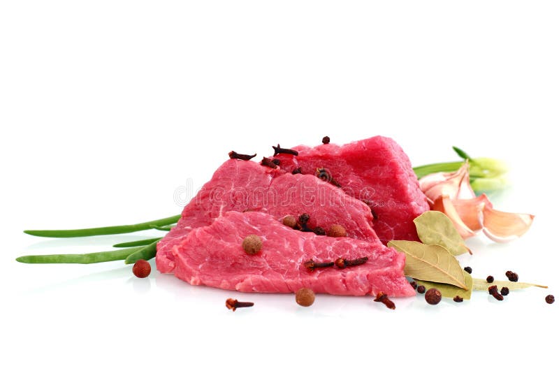 Cut of beef steak with garlic slice, onion and