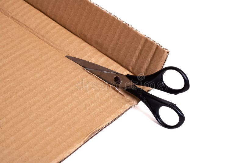 Cut Cardboard with Scissors Isolated on White Background Stock