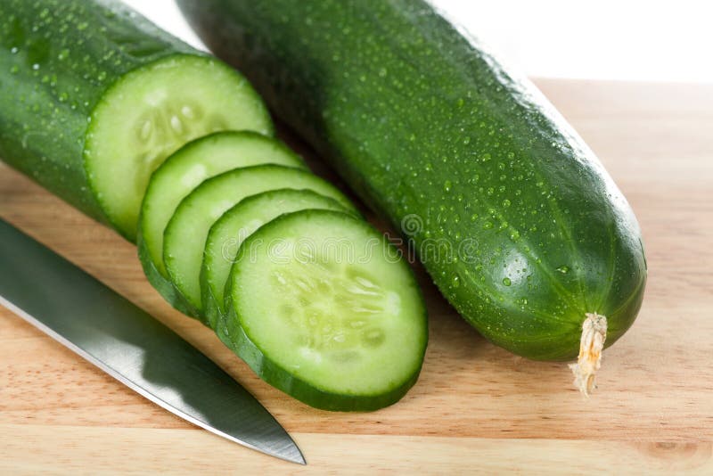 Cut cucumbers and knife