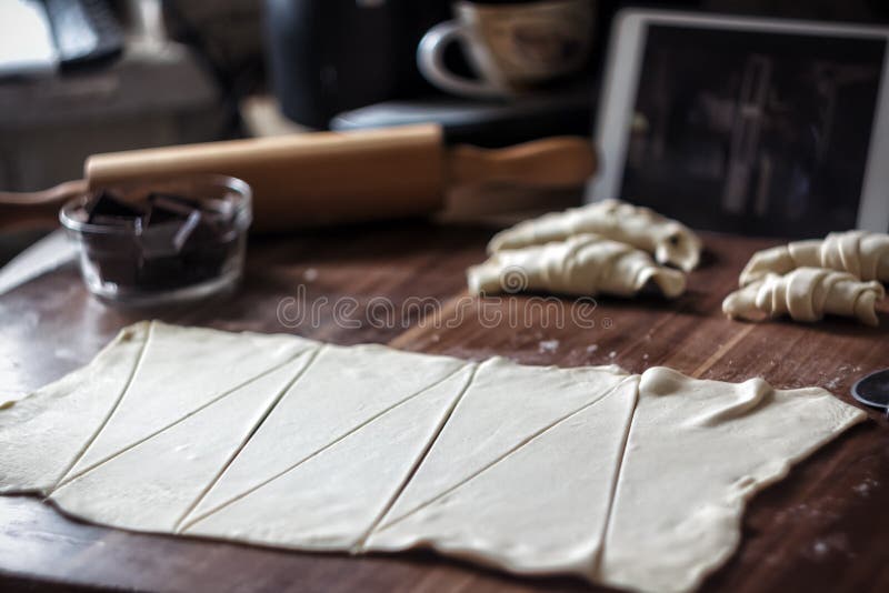 Cut the Dough into Triangles for Croissants with Chocolate Stock Image