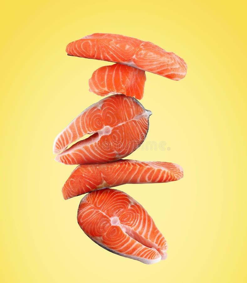 Cut Fresh Salmon Falling on Yellow Background Stock Photo Image of