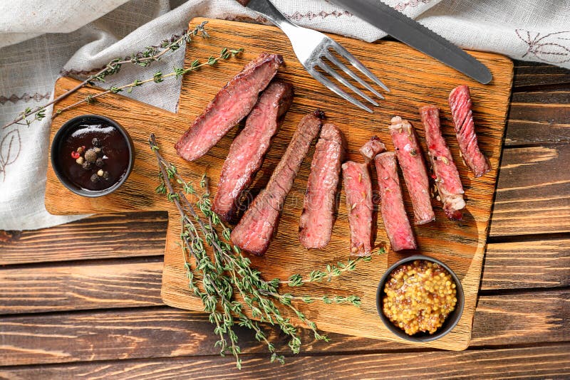 Cut Grilled Steak with Sauces on Wooden Board Stock Image Image of herb, eating 151215789