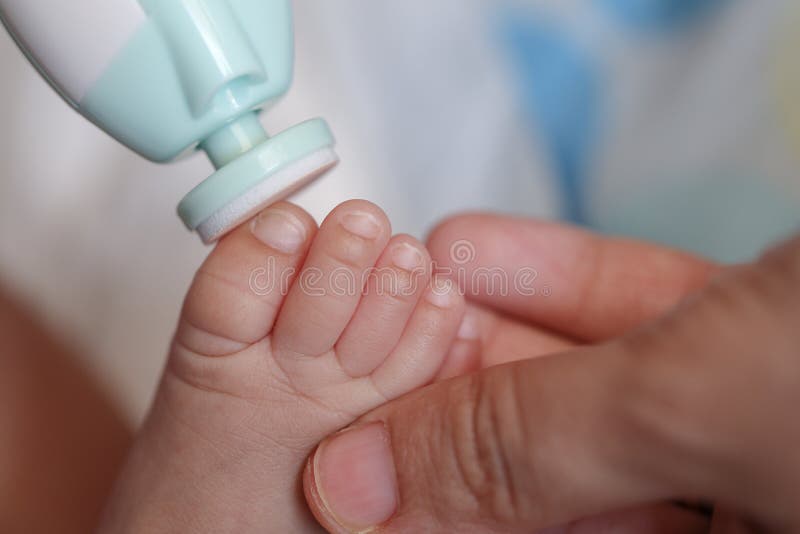 Mother Filling Baby Nails Using Automatic Baby Nail File Machine. Stock Image - Image of cleaning, adult: 149071027 Mother Filling Baby Nails Using Automatic Baby Nail File Machine. Stock Image - Image of cleaning, adult: 149071027