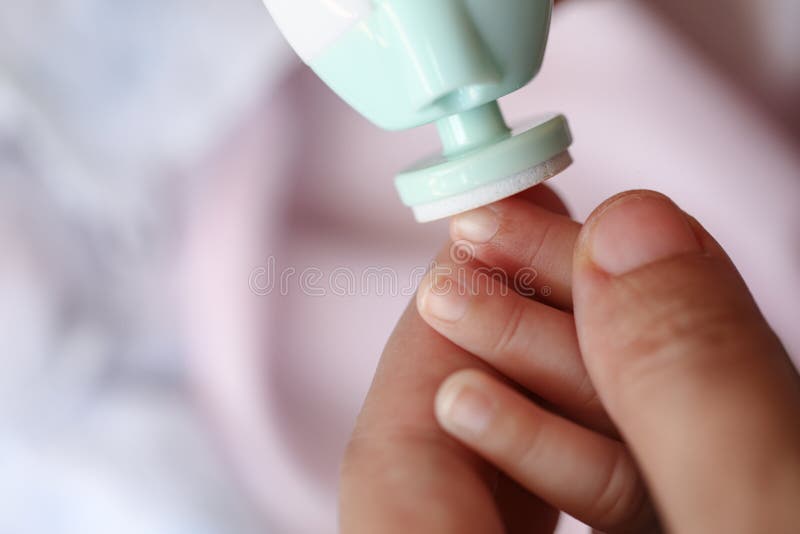 Mother Filling Baby Nails Using Automatic Baby Nail File Machine. Stock  Image - Image of gloves, beauty: 149070983