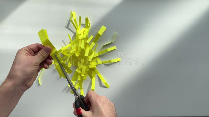 Cut paper with scissors stock footage