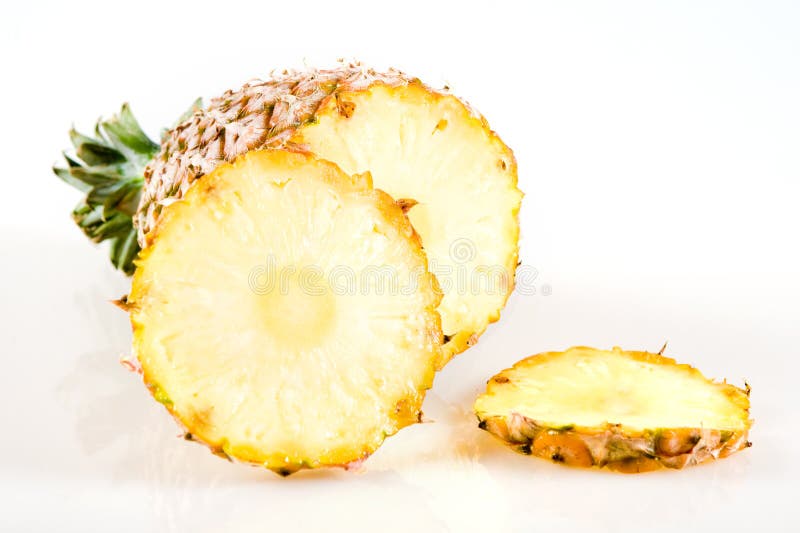 Cut pineapple isolated on white