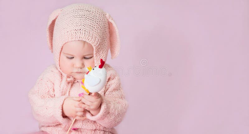 Cute adorable baby girl closeup portrait in knitted costume of E royalty free stock images Cute adorable baby girl closeup portrait in knitted costume of E royalty free stock images