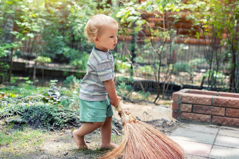 Cute Adorable Caucasian Toddler Boy Playing Holding Broom at Backyard ...