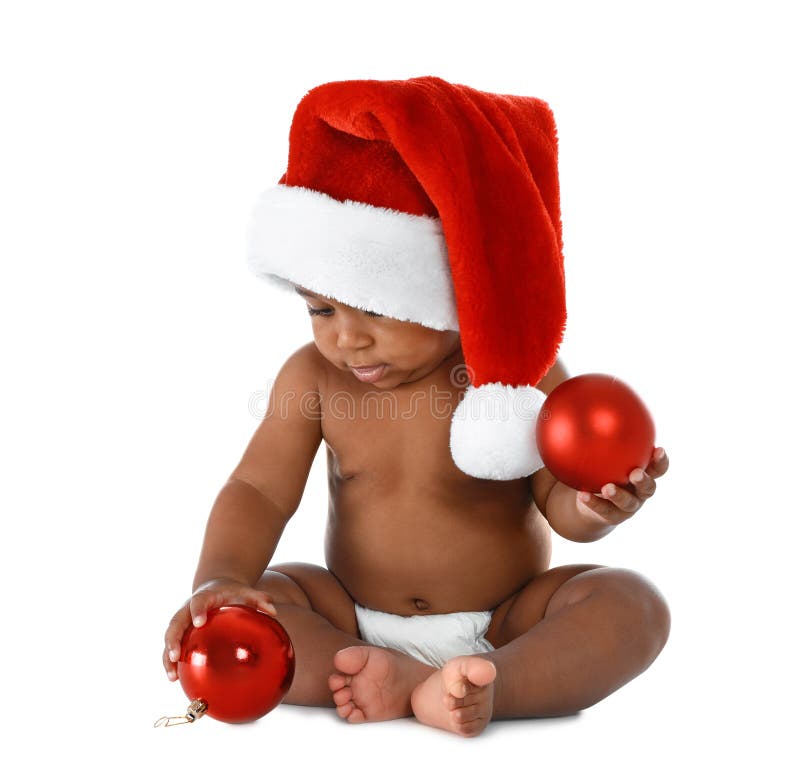 Cute African-American Baby Wearing Santa Hat with Christmas Decorations
