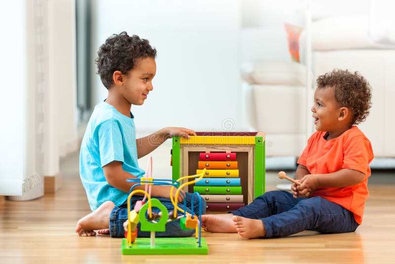 Cute african american brothers child playing together royalty free stock images Cute african american brothers child playing together royalty free stock images