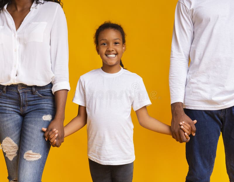 Cute african american girl holding hands of her parents royalty free stock images Cute african american girl holding hands of her parents royalty free stock images