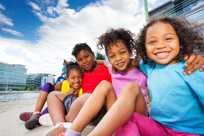 Cute African children having fun together outdoors stock images Cute African children having fun together outdoors stock images