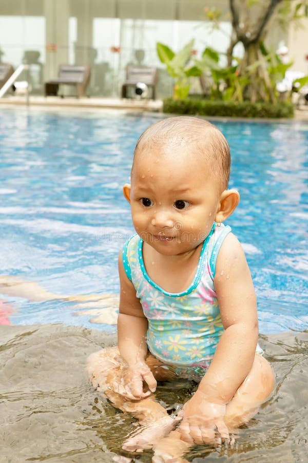 Cute Asian baby at swimming pool