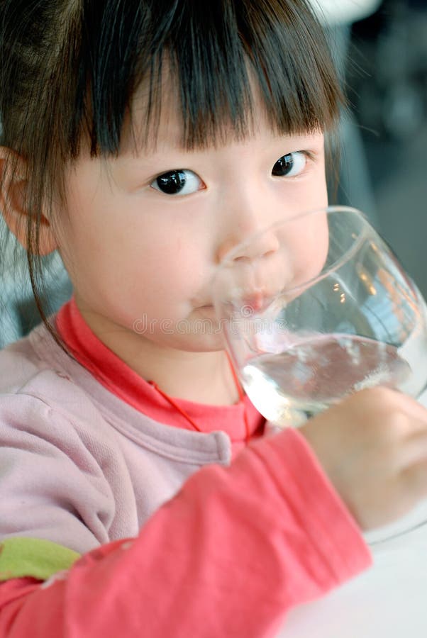 Cute Asian child Drink water