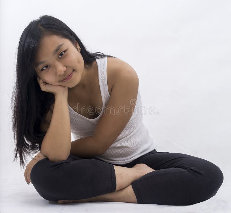 Cute asian girl on background meditating stock images Cute asian girl on background meditating stock images