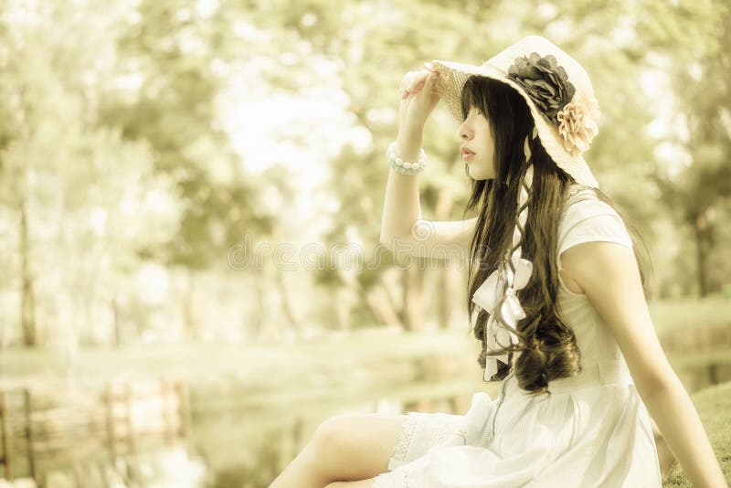 A cute Asian Thai girl is looking in the sky with hope stock images A cute Asian Thai girl is looking in the sky with hope stock images