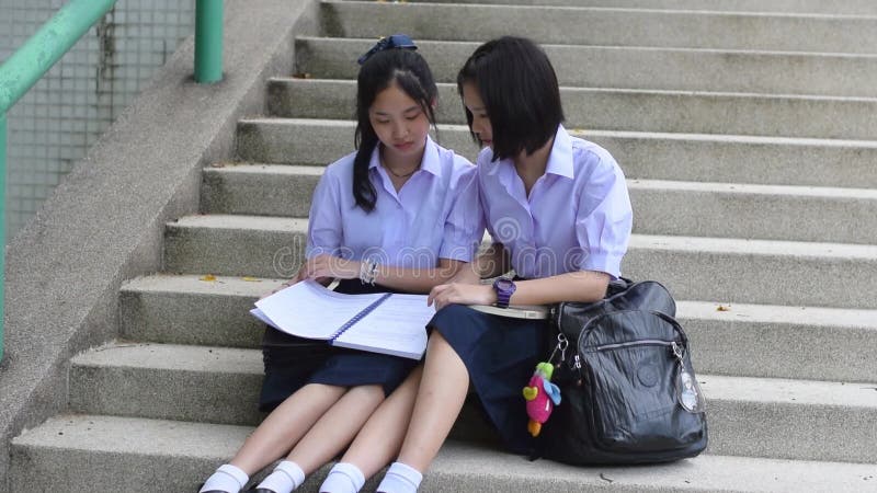 Asian Thai Schoolgirl Student in High School Uniform is Wearing Her ...