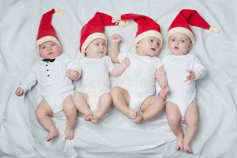 Cute babies with santa hats stock photos Cute babies with santa hats stock photos