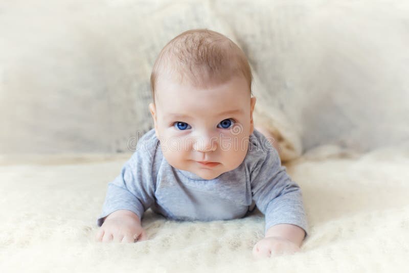 Cute Baby with Blue Eyes Crawling Forward Stock Image Image of care